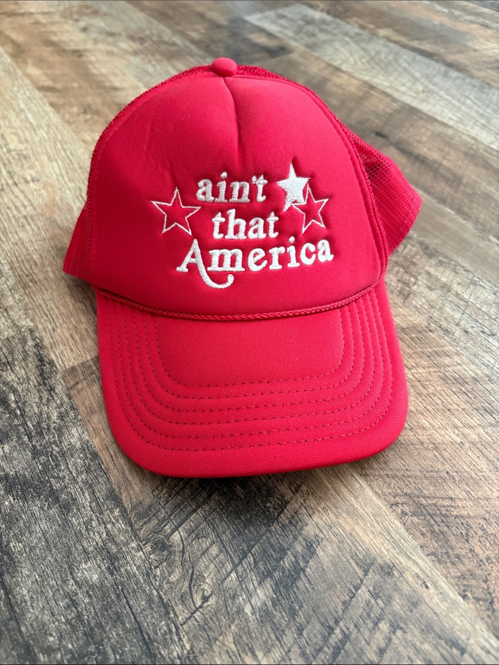 Red "ain't that America" Embroidered Trucker Hat